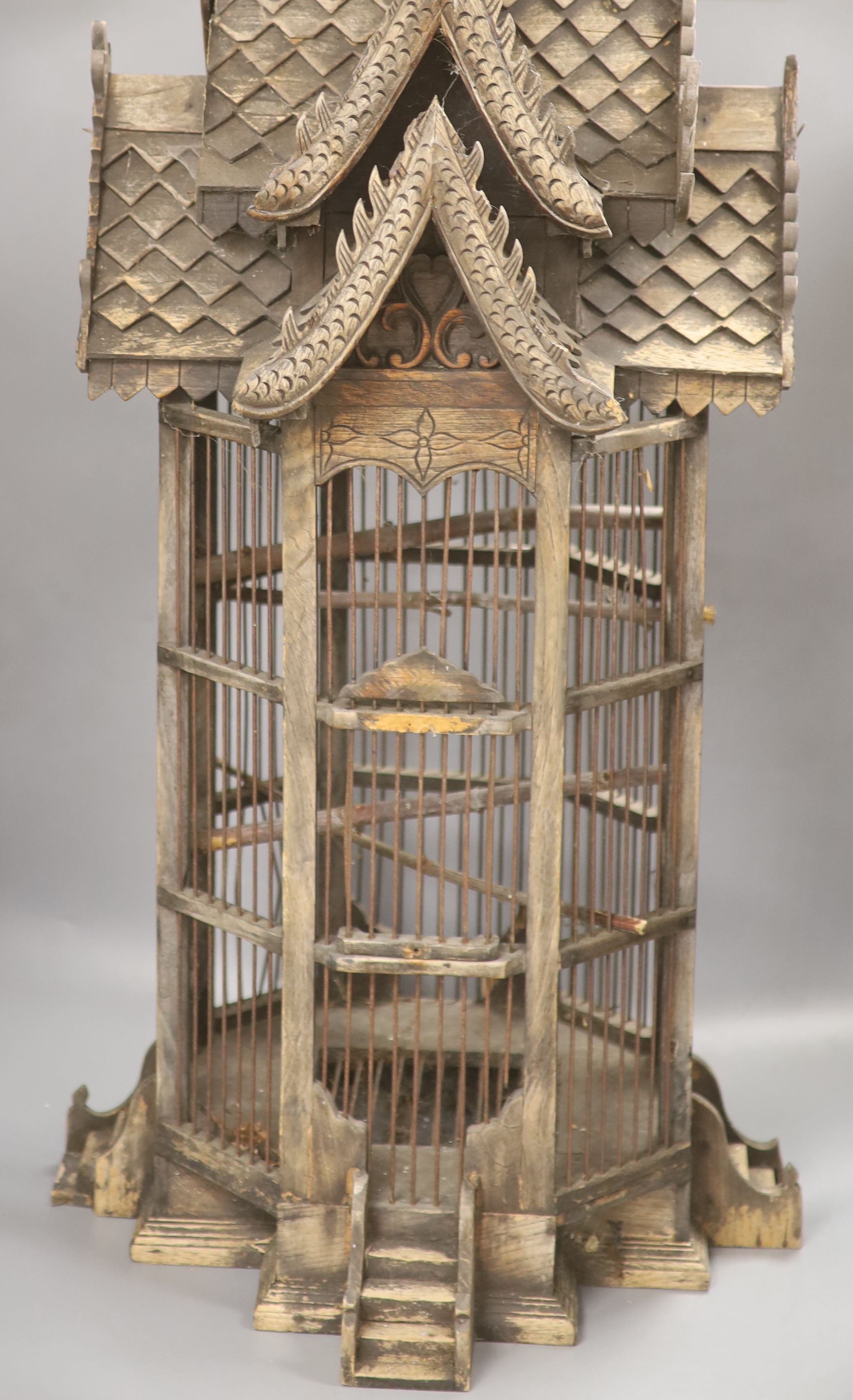 A carved wood birdcage, in Chinese style, height 80cm